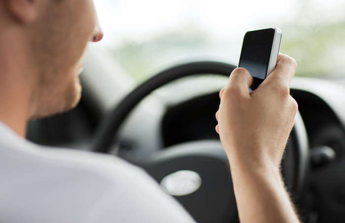 Can I be responsible for an accident if I was texting while driving?