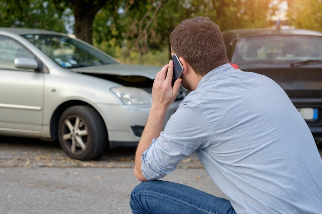 Man Calling Car Mechanic Insur 154605524 e1552881391485